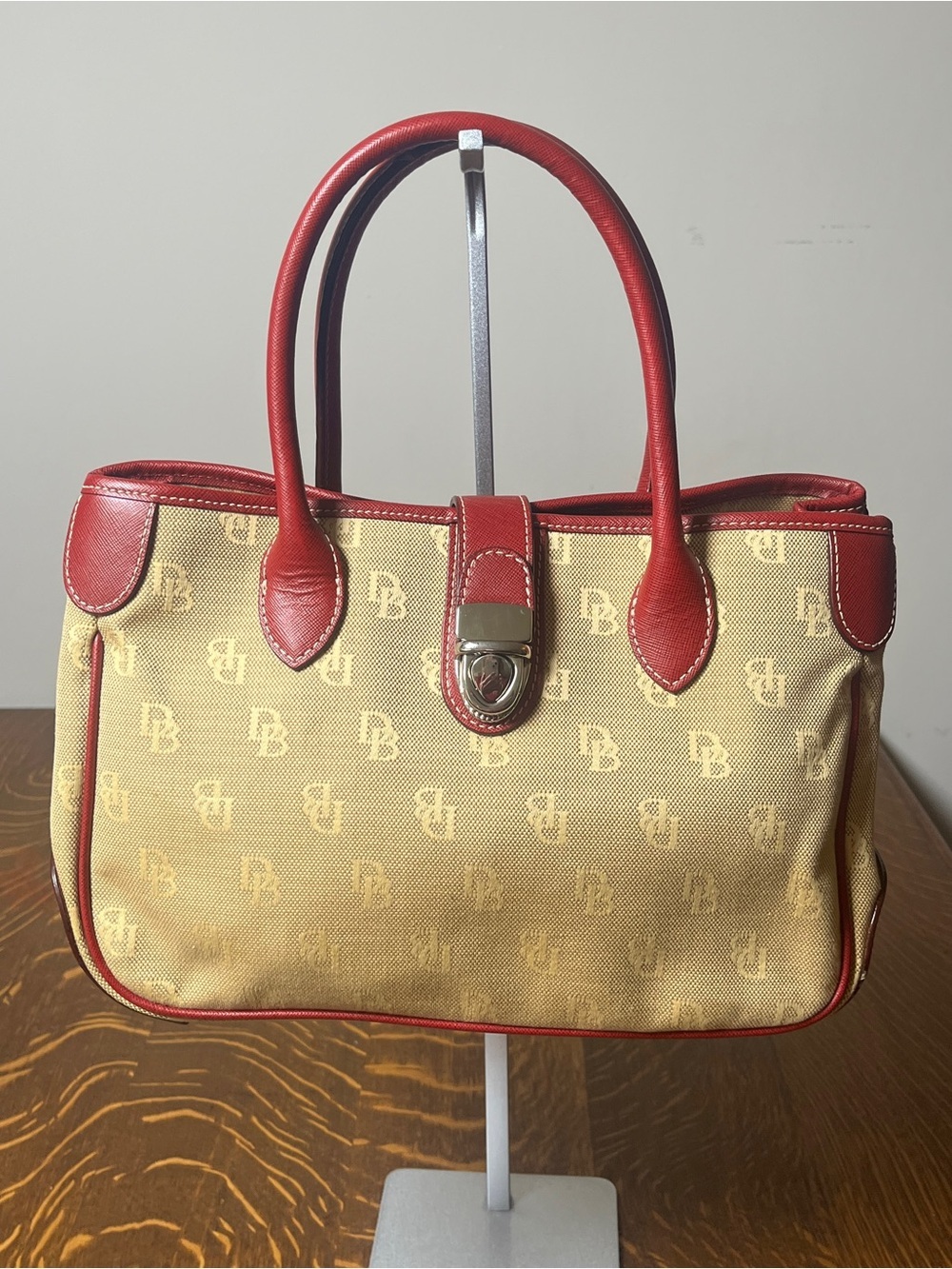 Dooney & Bourke Tan Monogram Canvas Satchel with Red Leather Trim Silver Lock.